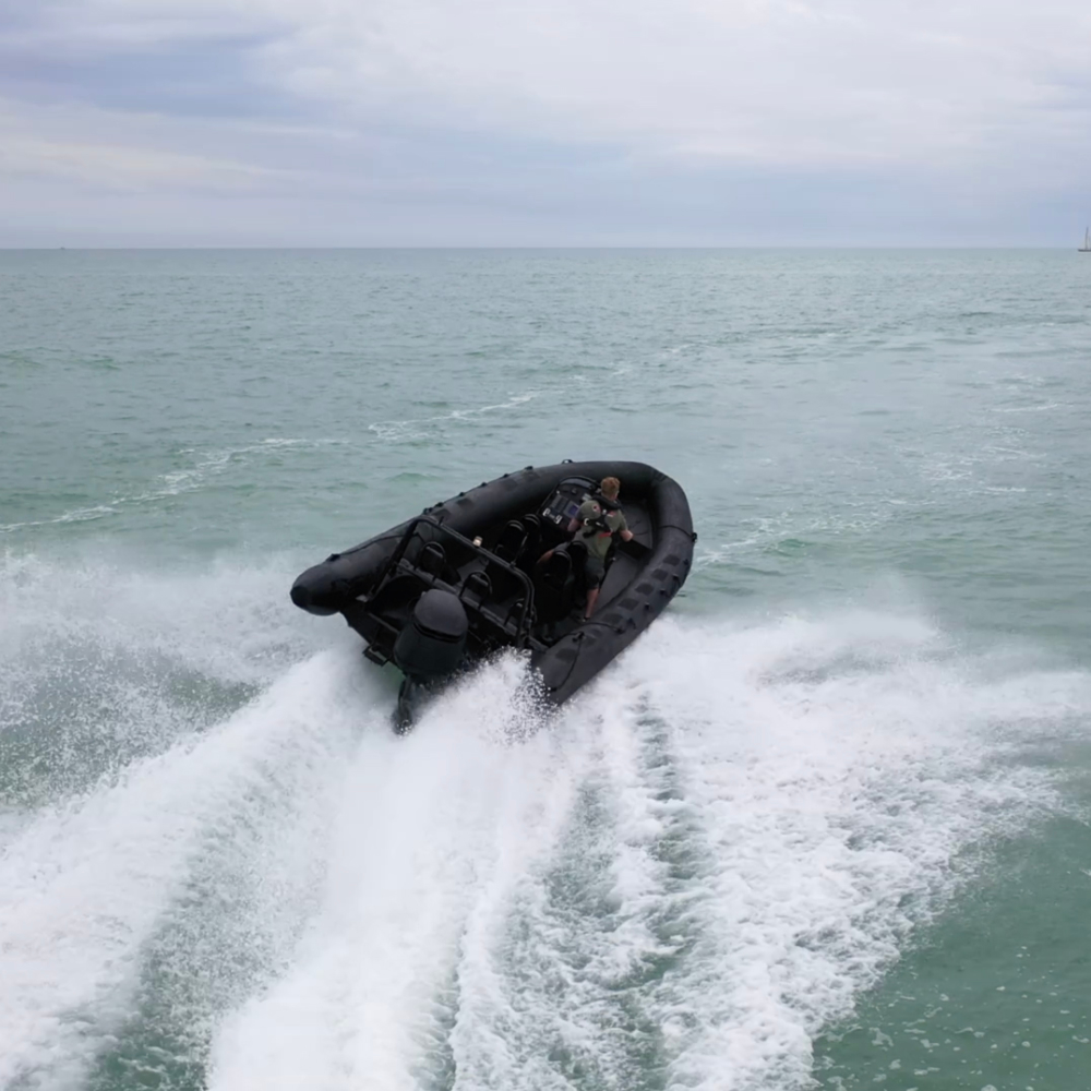 Excellent shot of the 8m RIB slicing through the ocean waters of Brighton. Beautiful blue sea with a greeny hue.